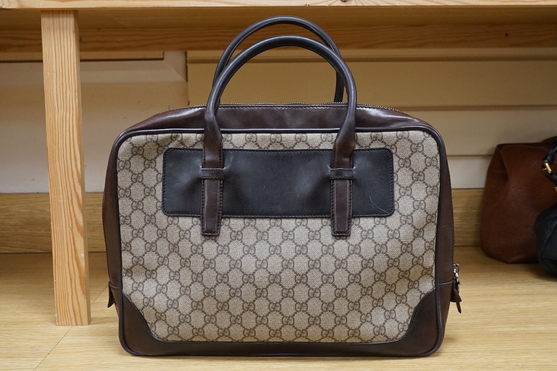 A Gucci supreme monogram travel case, 40cm wide